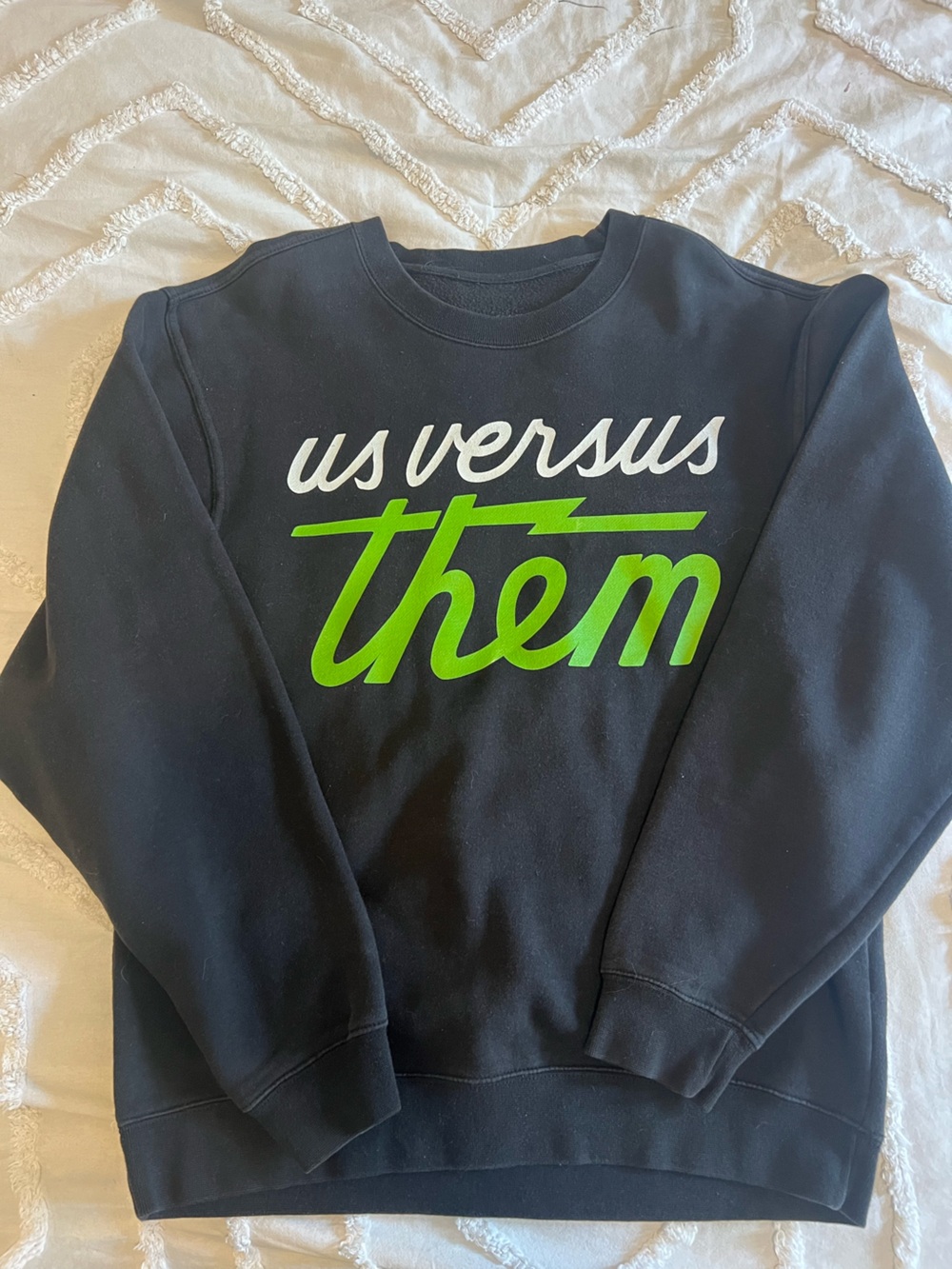 Black Sweatshirt with 'us versus them' Green & White Script